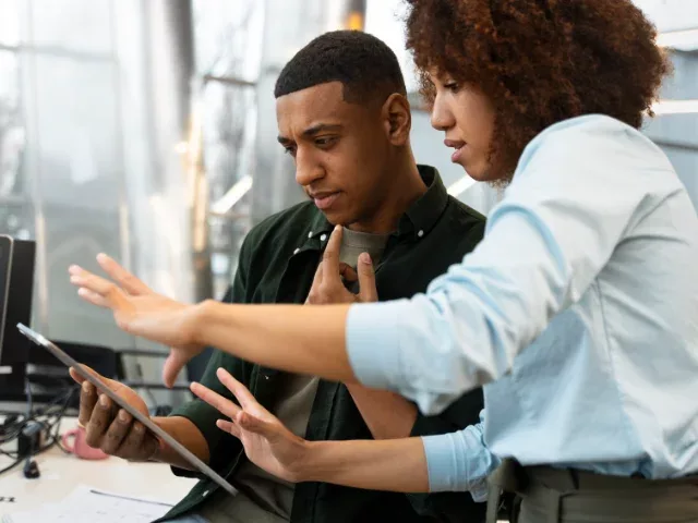 young professionals reviewing data on a tablet