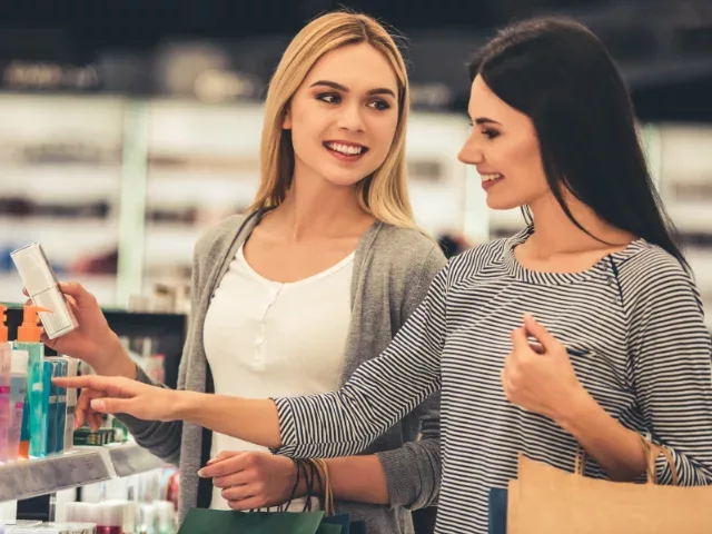 Two women shopping and scanning products