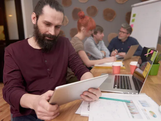 Man reviewing information on a ltablet